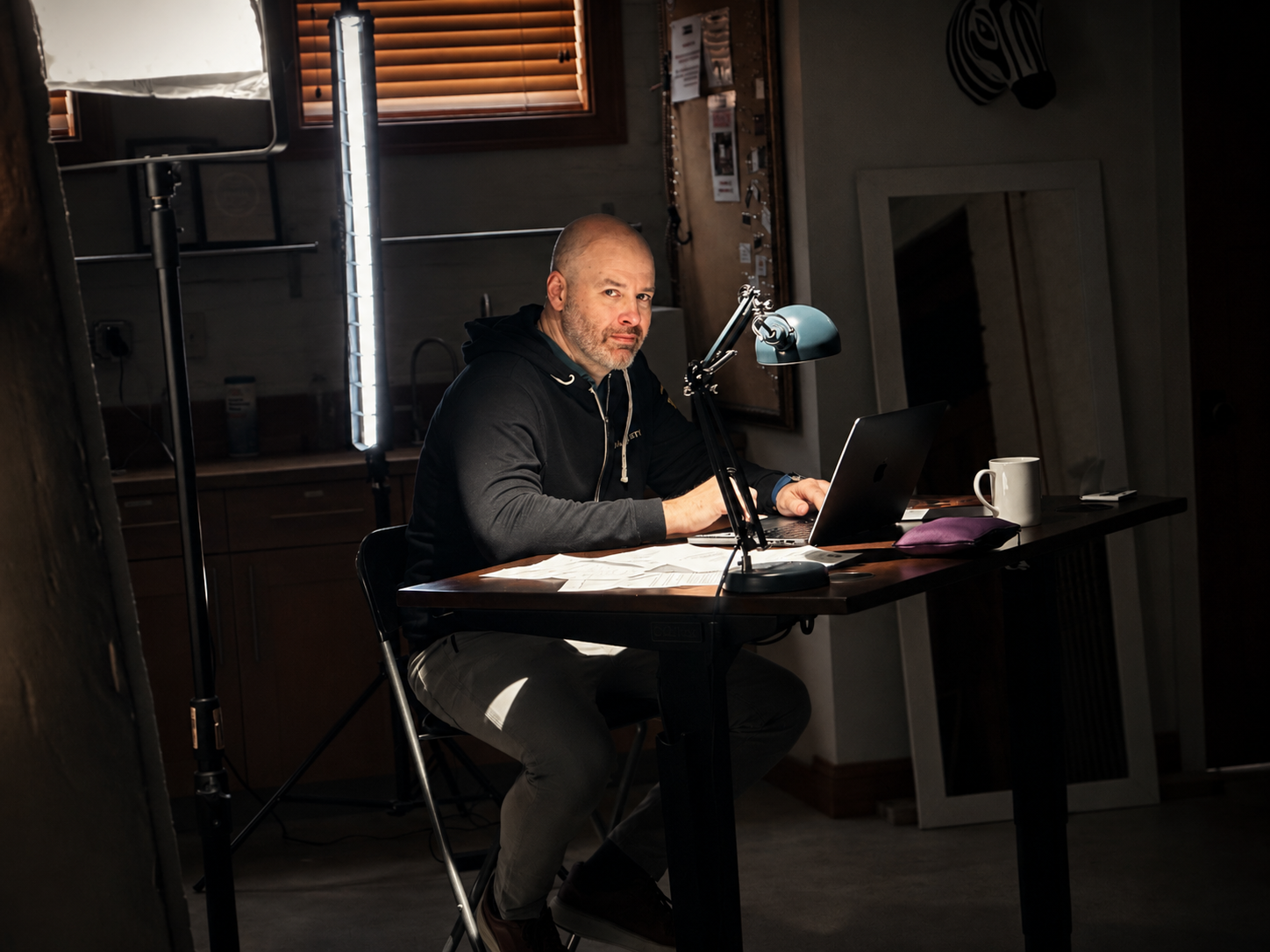 Jon DiMaggio reviewing cybercrime research at his desk